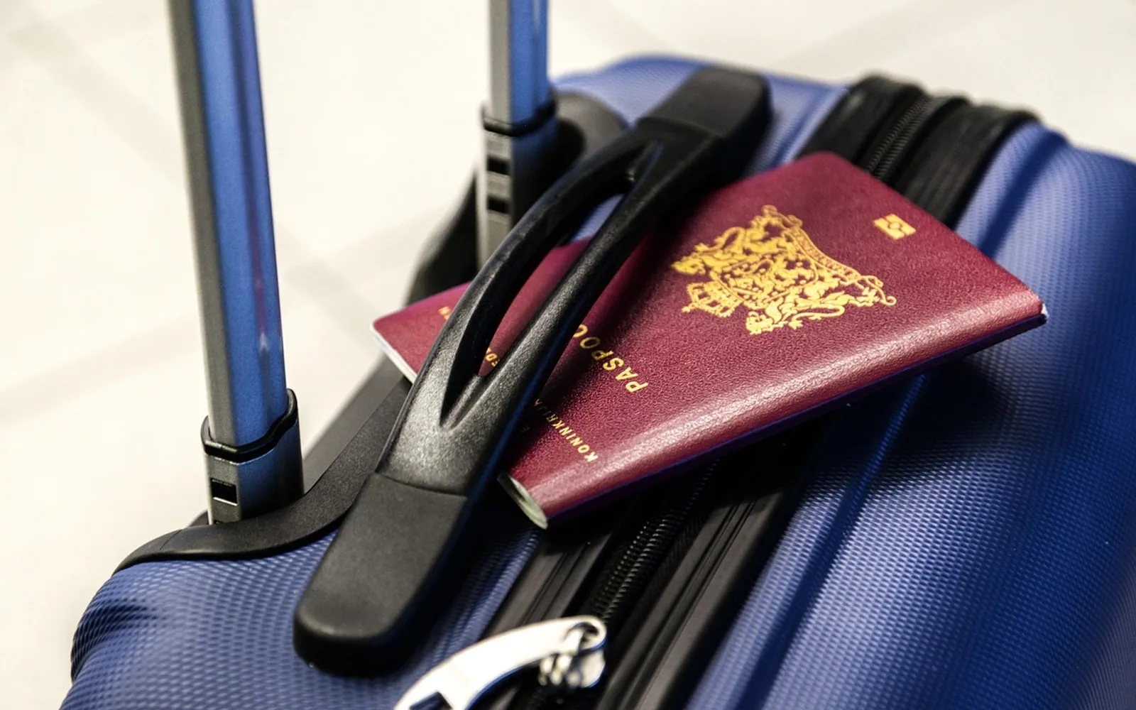 Passport, luggage and trolley
